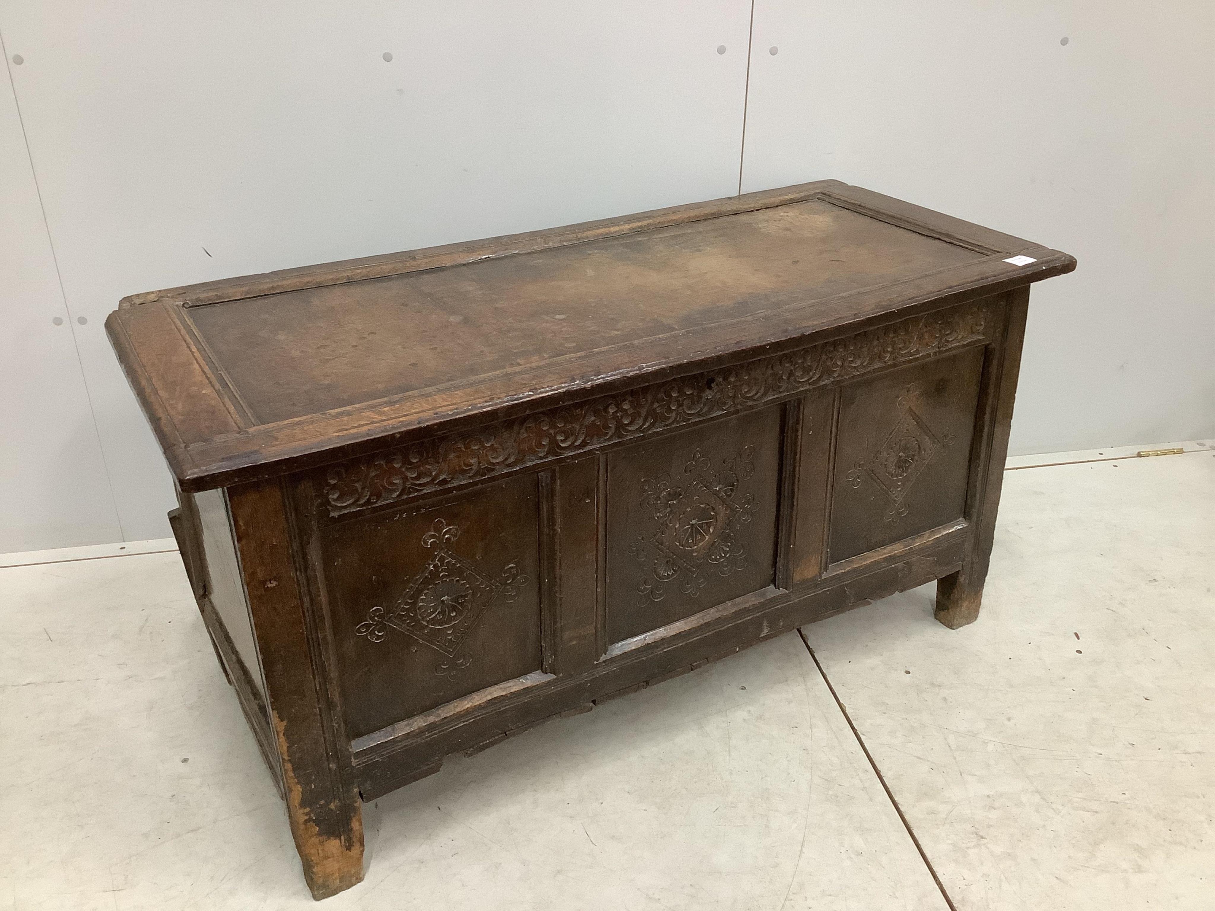 A late 17th century carved oak coffer, width 128cm, depth 56cm, height 66cm. Condition - poor